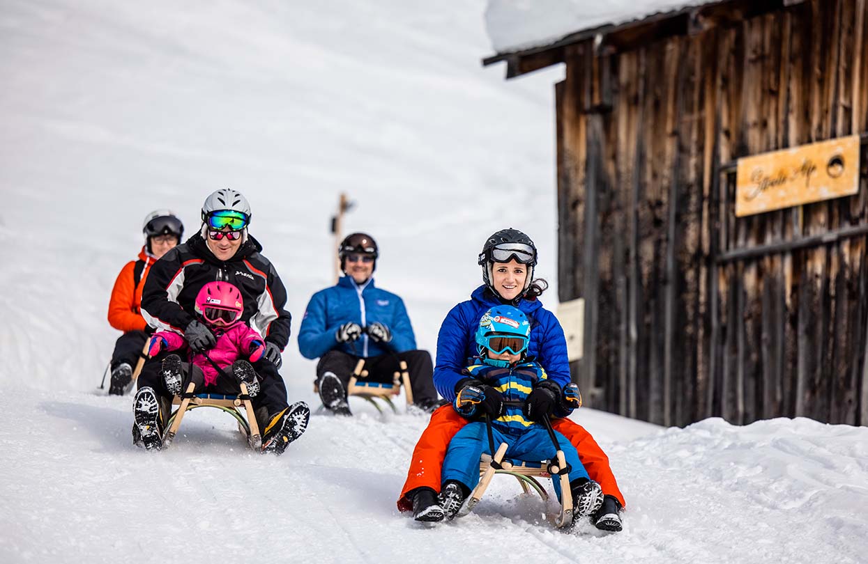 Sledging or Tobogganing is so much fun for the whole family, Image Copyright Martin Bissig